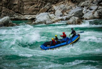 Feel the adrenaline rush as you navigate exciting river rapids.